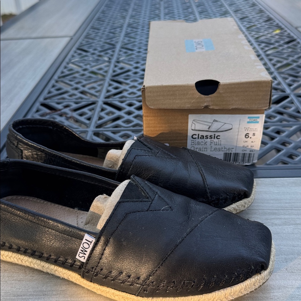 TOMS Classic Black Leather Slip-Ons